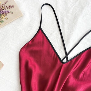 Elegant long red satin sleepwear robe with delicate silk finish and cross straps