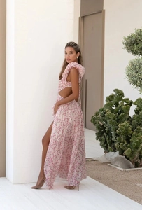 Detail of pink floral maxi dress with waist cut-out and side slit in resort style