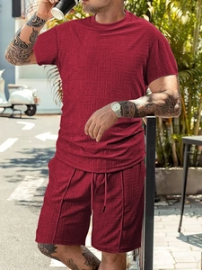 Detail of burgundy waffle knit texture on men's casual summer short sleeve and shorts set