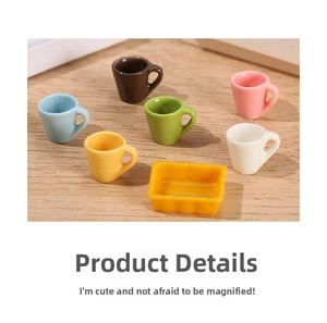 Miniature dollhouse set with 6 colorful ceramic cups and a yellow tray on wood table