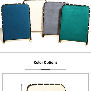 Detailed view of jewelry display boards with velvet finish and gold metal frames