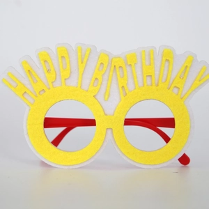 Detail of yellow felt Happy Birthday glasses with red frames for creative party fun