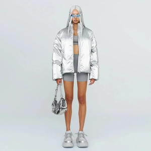 Silver metallic puffer jacket with high collar and futuristic style for winter
