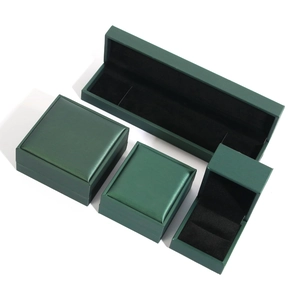 Dark green jewelry box set including necklace, bracelet and ring cases with black velvet