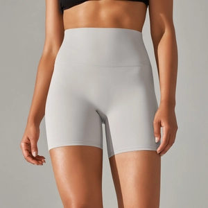 Detailed texture of seamless high-waist grey yoga shorts with elastic peach lift fabric