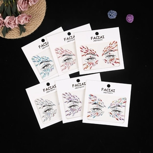 Detailed view of colorful acrylic facial diamond stickers for music festival makeup sets