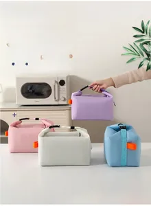 Detail of multi-color thermal lunch bags showing high-density Oxford cloth and handle