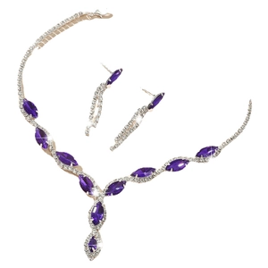 Elegant silver jewelry set with purple marquise gems and rhinestones on white background