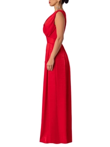 Side view of red sleeveless wide leg jumpsuit showing slim fit cut and textured fabric