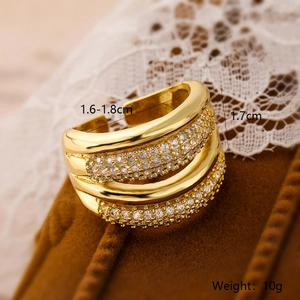 Detail of adjustable gold-plated wide band ring with zircons showing size parameters