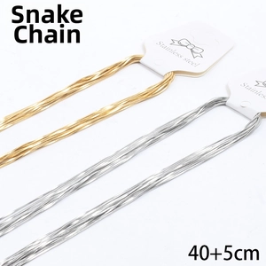Detailed view of gold and silver square snake chains with 40+5cm length specifications