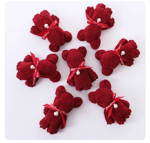 Red coral fleece towel folded as teddy bear with pearl bow for gift favors