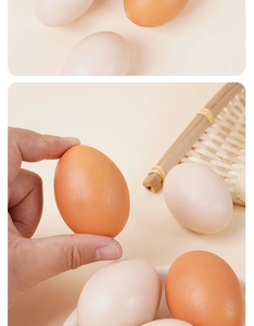 Detailed view of realistic brown and beige egg models in a woven bamboo basket
