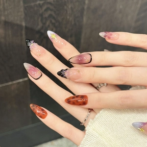 Roze paarse gradiënt kunstnagels met zwarte 3D-strik en sterren luipaardpatroon