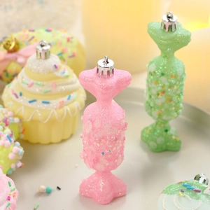 Pink and green candy-shaped Christmas ornaments with glitter finish for tree decor
