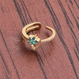 Gold V-shaped adjustable ring with blue star zircon and micro-pave accents