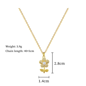 Detail of gold flower pendant with pearl and diamonds, including dimensions and weight