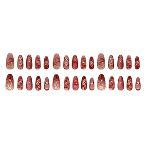 Cat eye almond press-on nails with 3D red heart and bowknot designs on white background