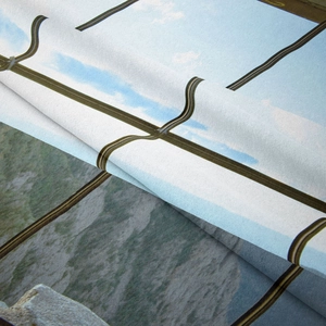 Macro detail of Bohemian tapestry showing digital landscape print on textured fabric