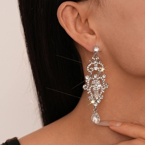 Elegant silver tassel earrings with sparkling rhinestones in a vintage hollow pattern
