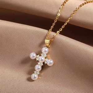 Elegant gold titanium steel cross necklace with white pearls and sparkling zircons