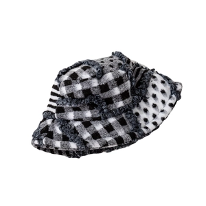Checkered wool bucket hat with frayed edges in black and white minimalist style