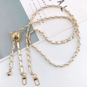 Gold metal and white leather braided crossbody strap with adjustable gold sphere bead