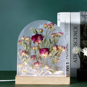 Arch-shaped resin night light with preserved red roses on rectangular wooden base