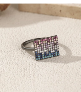 Detail of S925 silver ring featuring rows of pink, purple, white and blue crystals
