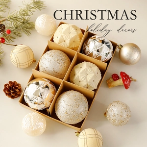 Elegant champagne gold Christmas ball ornaments set in a gift box with tree decor