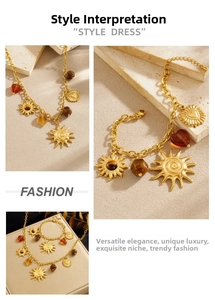 Detail of vintage gold sun pendants and amber heart beads on chain necklace set
