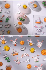 Detailed macro view of 5D embossed nail stickers featuring cute rabbit and lotus patterns