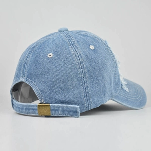 Light blue distressed denim baseball cap with vintage frayed edges and metal buckle