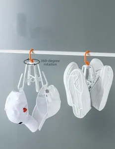 Detail of 360-degree rotating shoe rack holding baseball caps and white sneakers