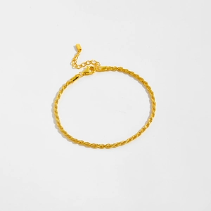 Detailed close-up of a S925 sterling silver gold twisted rope chain bracelet with lobster clasp