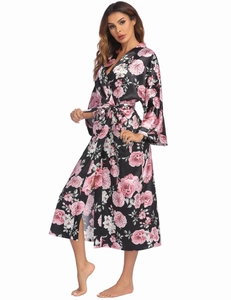 Detail of floral satin bathrobe showing silky texture and pink flower patterns