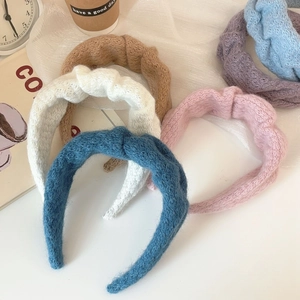 Detailed texture of colorful knitted headbands with soft wool fabric in a cozy setup