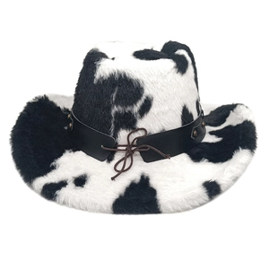 Detail of faux fur cow print cowboy hat with black leather stud band and tassel