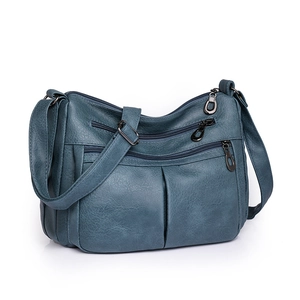 Minimalist navy blue shoulder bag with multi-layer zipper pockets and textured leather