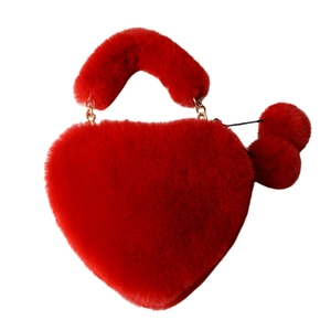 Furry heart-shaped handbag in bright red with plush handles and decorative poms