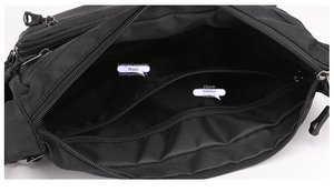 Interior view of large capacity black commuter bag with zipper pocket and main compartment