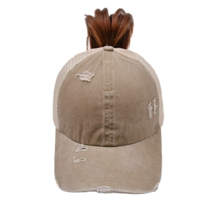 Detail of cross ponytail opening and breathable mesh on washed khaki baseball cap