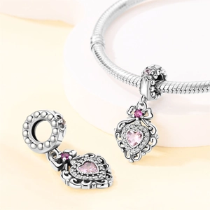 Romantic silver plated bracelet with pink heart gemstone and sparkling starlight charms