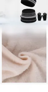 Detailed view of the thick fleece lining in the winter hat, neck warmer, and gloves set