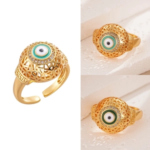 Detail of 18K gold evil eye ring with blue enamel, zircons and Greek key cutouts
