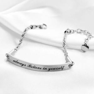 Macro shot of silver stainless steel bracelet featuring engraved ALWAYS BELIEVE IN YOURSELF