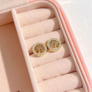Golden Tree of Life stud earrings with crystal halo in a pink velvet jewelry box
