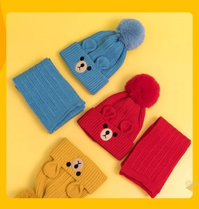 Detailed set of knit hats and scarves featuring bear embroidery and plush pom-poms