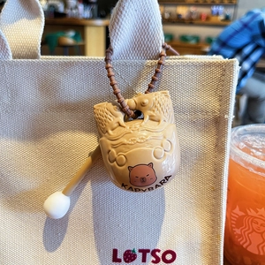 Cute Capybara wooden fish keychain decompression toy hanging on a canvas bag