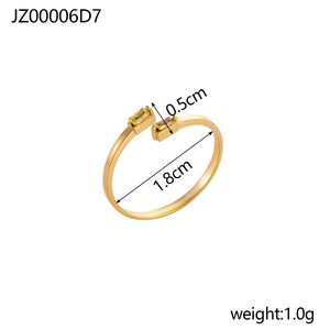 Detailed view of golden asymmetric open ring with dimensions and yellow gemstones